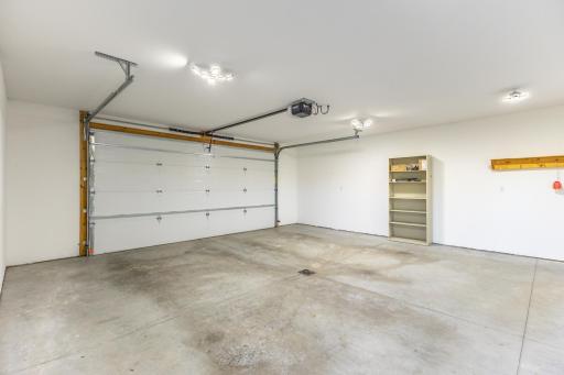 Heated and finished attached garage provides excellent parking, workspace and storage.