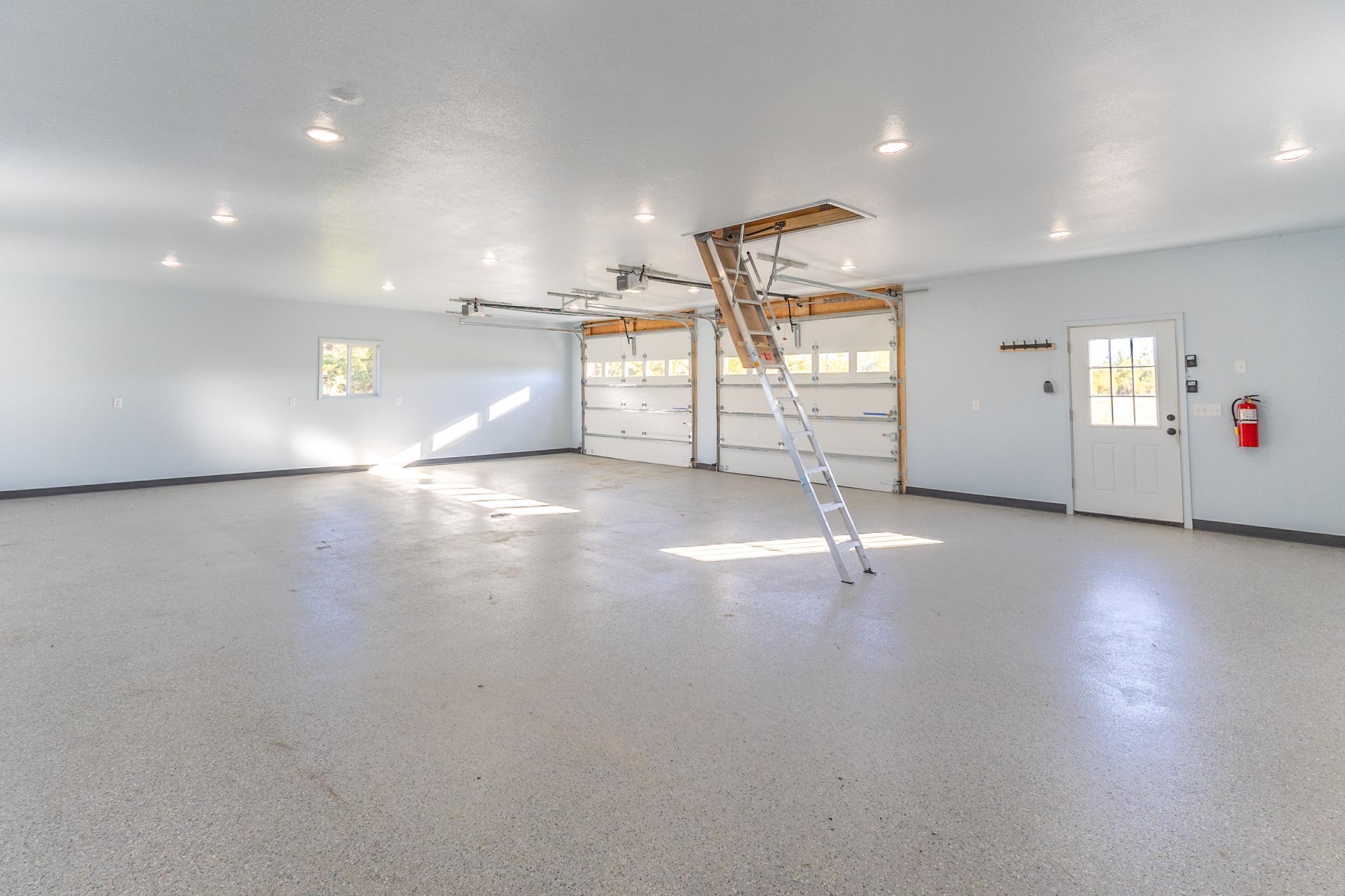 Heated 30x40 shop with epoxy floor, high ceilings and room for vehicles, toys or projects.