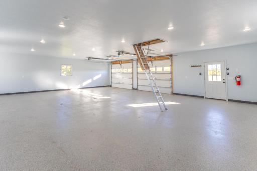 Heated 30x40 shop with epoxy floor, high ceilings and room for vehicles, toys or projects.