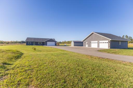 2023-built one-level home on nearly 3 acres with heated attached garage and 30x40 detached shop.