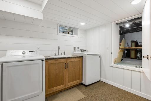 Lower level is finished - the storage space to the right has pull down stairs for easy access