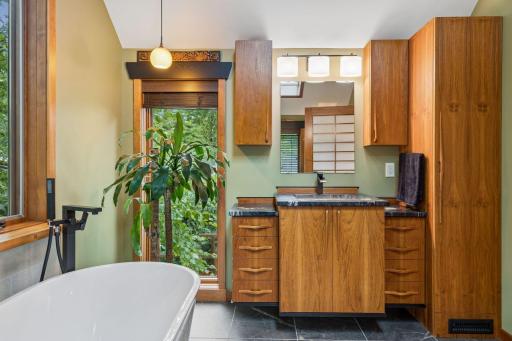 Spa like bathroom that makes you feel like you are at a resort. Teak vanity with storage.