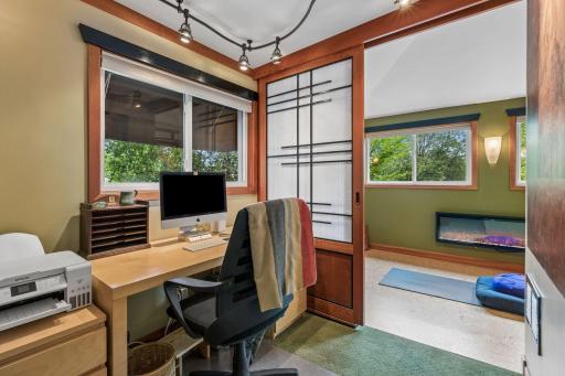 Office space off the bedroom has a sliding door to close off the yoga/meditation space.