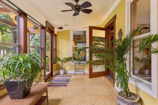 The wrap around, enclosed 3 season porch provides a drop zone and great spaces for relaxing and entertaining