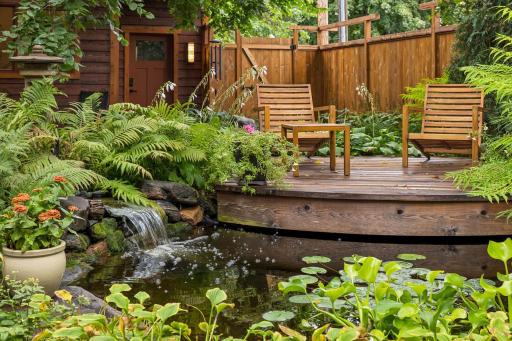 Can you image reading your book, drinking your coffee, or having a glass of wine at the end of the day and overlooking this? Wow! You may need to add more chairs - this area is bound to become a favorite of family and friends!