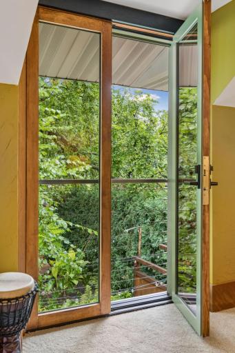 Wake up to views of the tree tops - door opens to give views of the spectacular back yard