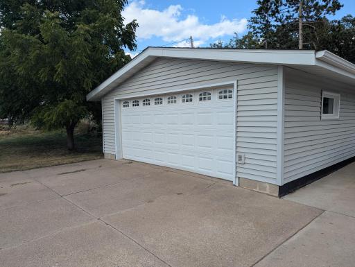 The 22x32, 2 car garage has a cement parking pad on two sides and brand new shingles.