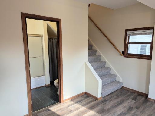 The full bath is located right at the bottom of the stairs.