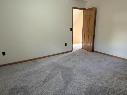 Fresh, buttery yellow paint, solid panel doors and brand new carpet throughout the upstairs bedrooms.