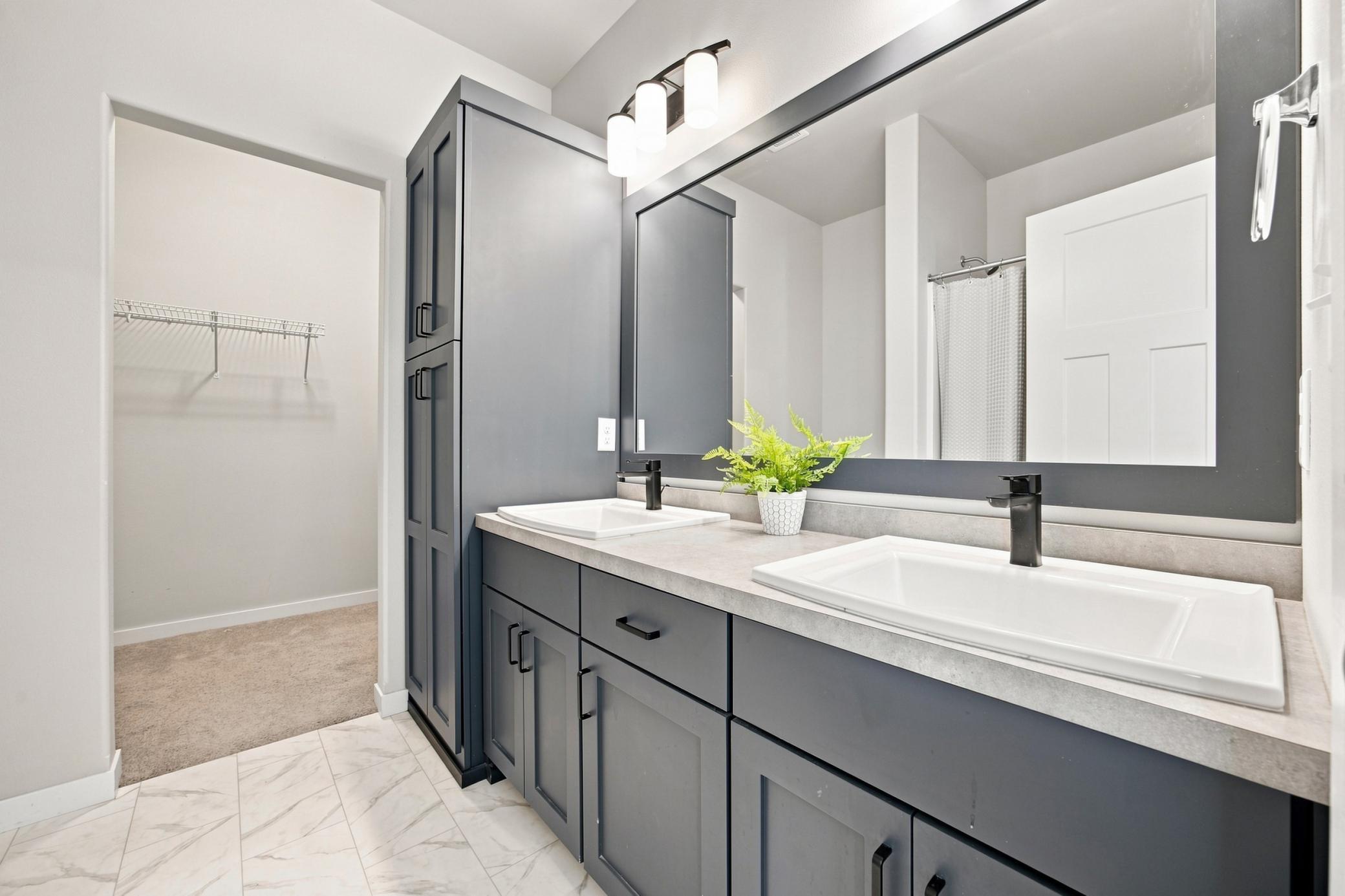 primary bath- dual sinks and full linen storage