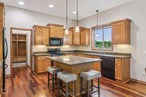 Great kitchen with a center island ideal for cooking, prepping, and snacking! There is lots of cabinet and counter space throughout.