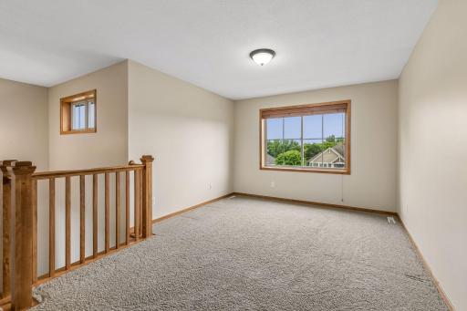 Upper level loft area that has plenty of options for use!