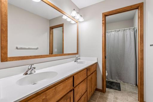Bathroom on the upper level with double sinks and double the cabinet storage! Great opportunity for organization.
