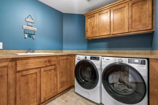 Laundry room is upstairs! A huge bonus. New washer and dryer in June of 2026! There is great cabinet space and countertop space.