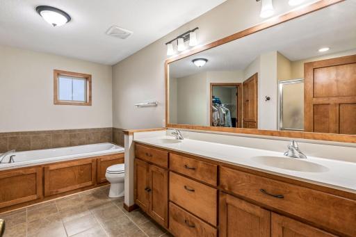 Double sinks and vanity space in your primary bathroom! It has a bath tub, shower and a walk-in closet.
