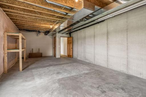 Another angle of your spacious unfinished area with a blank canvas.