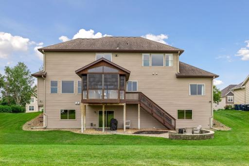 Back of your new house that shows your beautiful backyard and patio area.