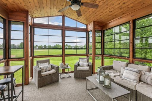 Your new favorite sitting area! Enjoy your three season porch that has beautiful views.