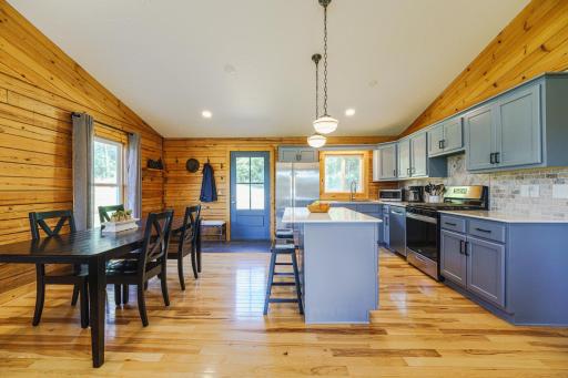 The kitchen features NEW Â¾- inch hickory hardwood flooring, a NEW center island with the option for seating, and refaced and painted cabinetry with updated hardware.