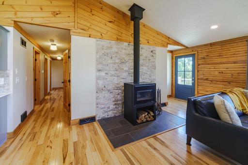 The Osburn woodstove is a wonderful addition to this family room, and keeps the space cozy in the winter months.