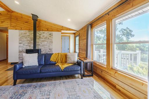 From the family room, there is a new TREX deck with a high-top seating bar that can be accessed via a new door with glass inlay that matches the front door.