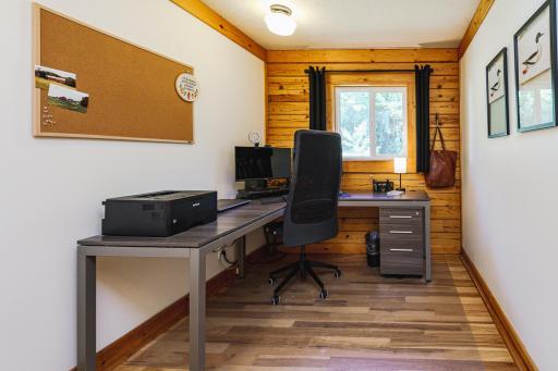 The main floor includes an office with a window overlooking the drive.