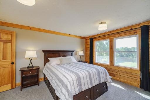 The primary bedroom overlooks the scenic landscape. This room has crown molding and a wide closet.