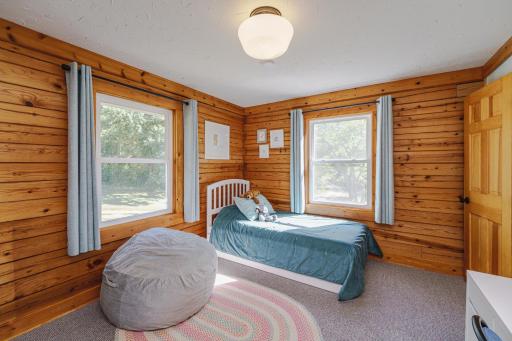 The additional two bedrooms are generously sized. This room has crown molding, a huge walk-in closet and overlooks the drive.