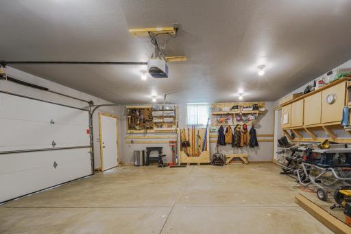 The extra-wide, heated and painted garage has a NEW garage door opener â Chamberlain B750 Â¾ HP Smart â just added in the summer of 2026.