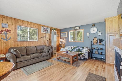 The living room offers a modern gas fireplace and room for entertaining