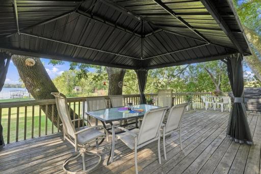 The gazebo stays with the home for the new buyer to enjoy! There is a power strip up top and a pole for a projector that comes down to use for movies. Seller would just hang a screen on the size of the gazebo to project onto!