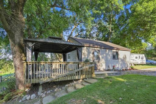 The deck is expansive and features covered and uncovered space to enjoy.