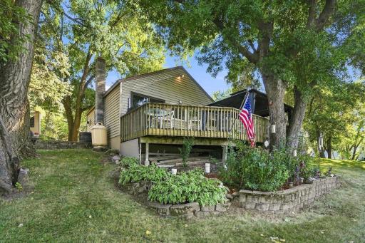 Beautiful landscaping sits below the expansive deck