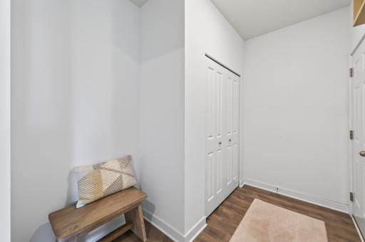 Mud room off of garage entry with nook and large coat closet