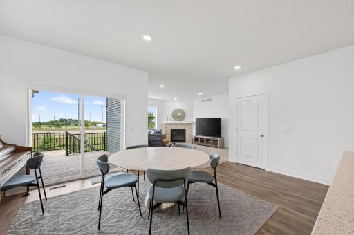 Dining area with sliding glass door to covered deck area