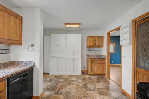 the kitchen includes lots of cabinet space
