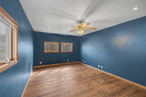 the larger living room is connected to the kitchen and main floor half bath