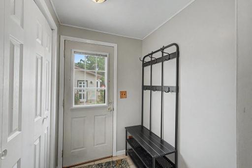 entry way off of the back of the house with lots of storage