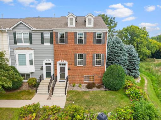 End-unit. Pond setting. Perfection! Beautifully maintained townhome move-in ready with an incredible setting!
