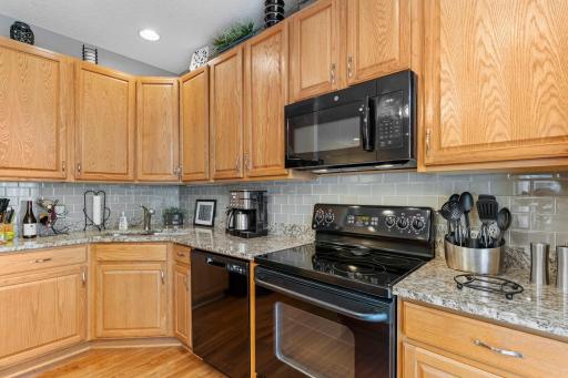 Granite countertops and subway tiled backsplash.