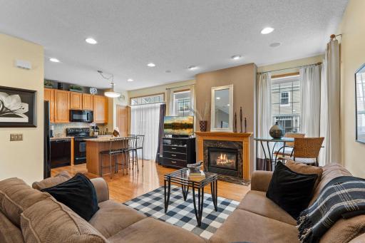 Cozy fireplace accented by windows! Fantastic family room located just off kitchen space.