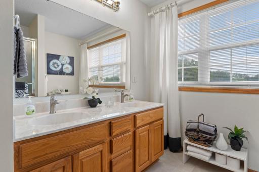 Primary bathroom with double sink vanity.