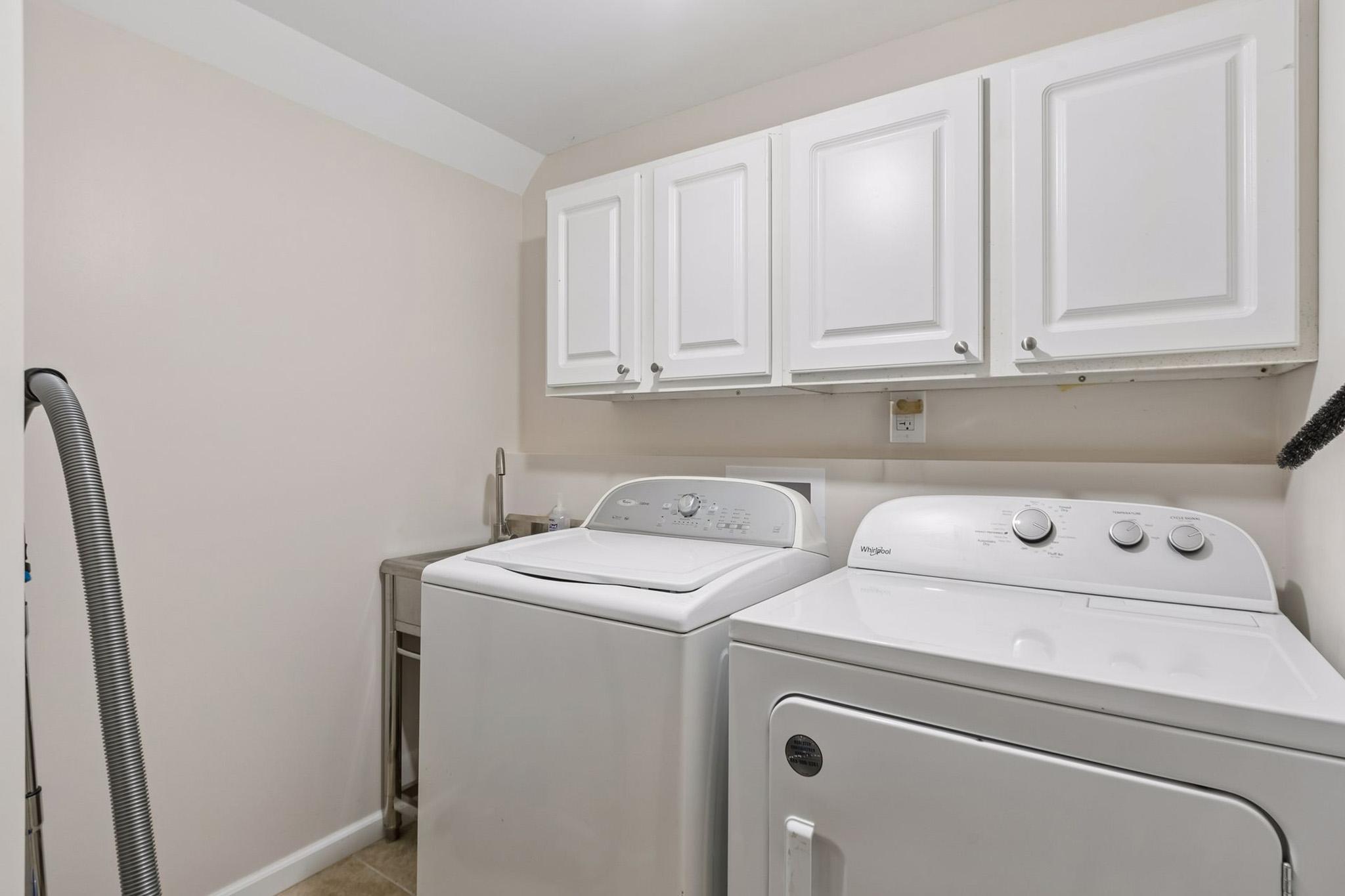 28. Finished laundry room featuring durable tile flooring.jpg