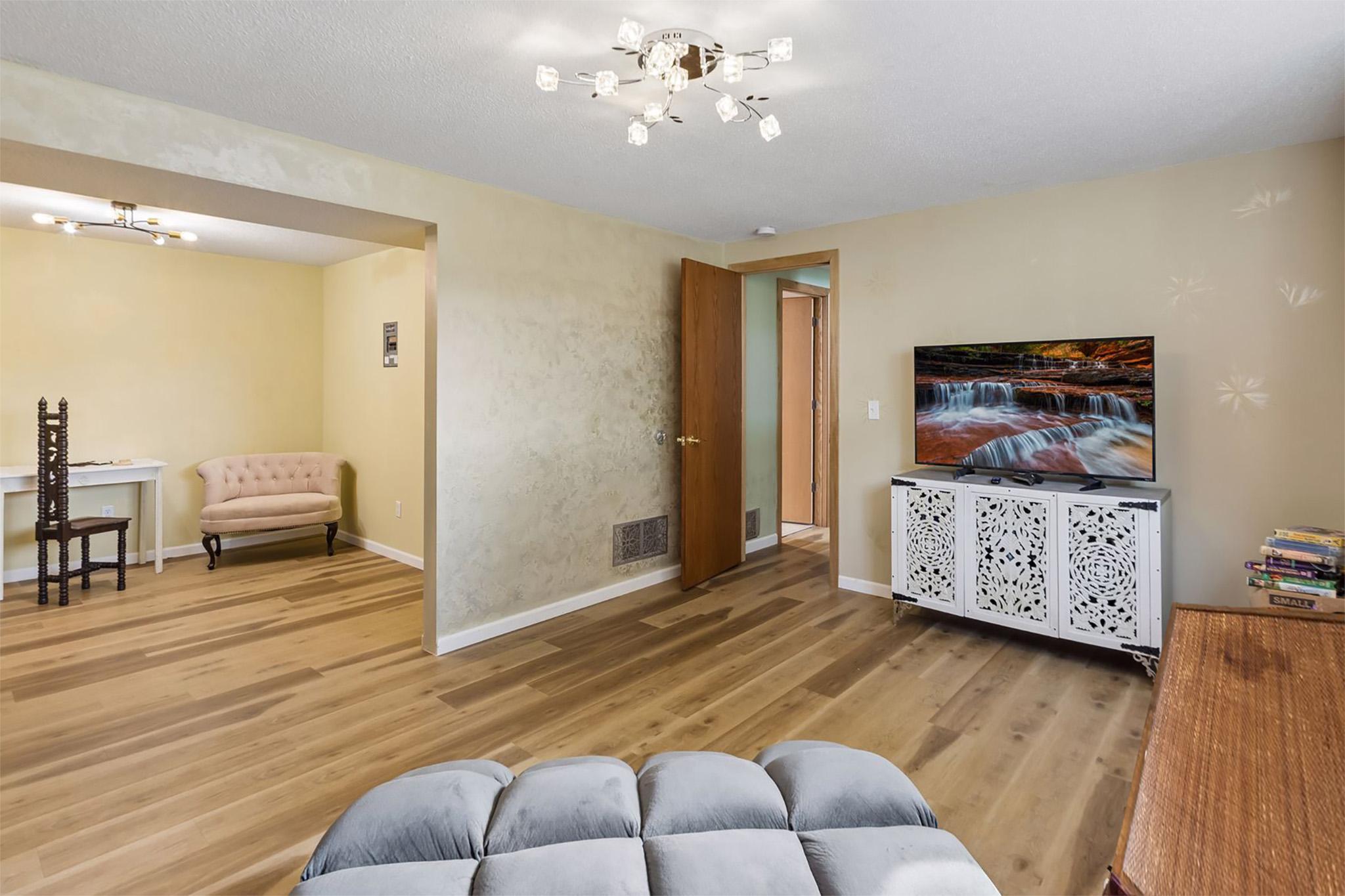 25. Open transition linking the cozy family room to the adjacent den or office.jpg