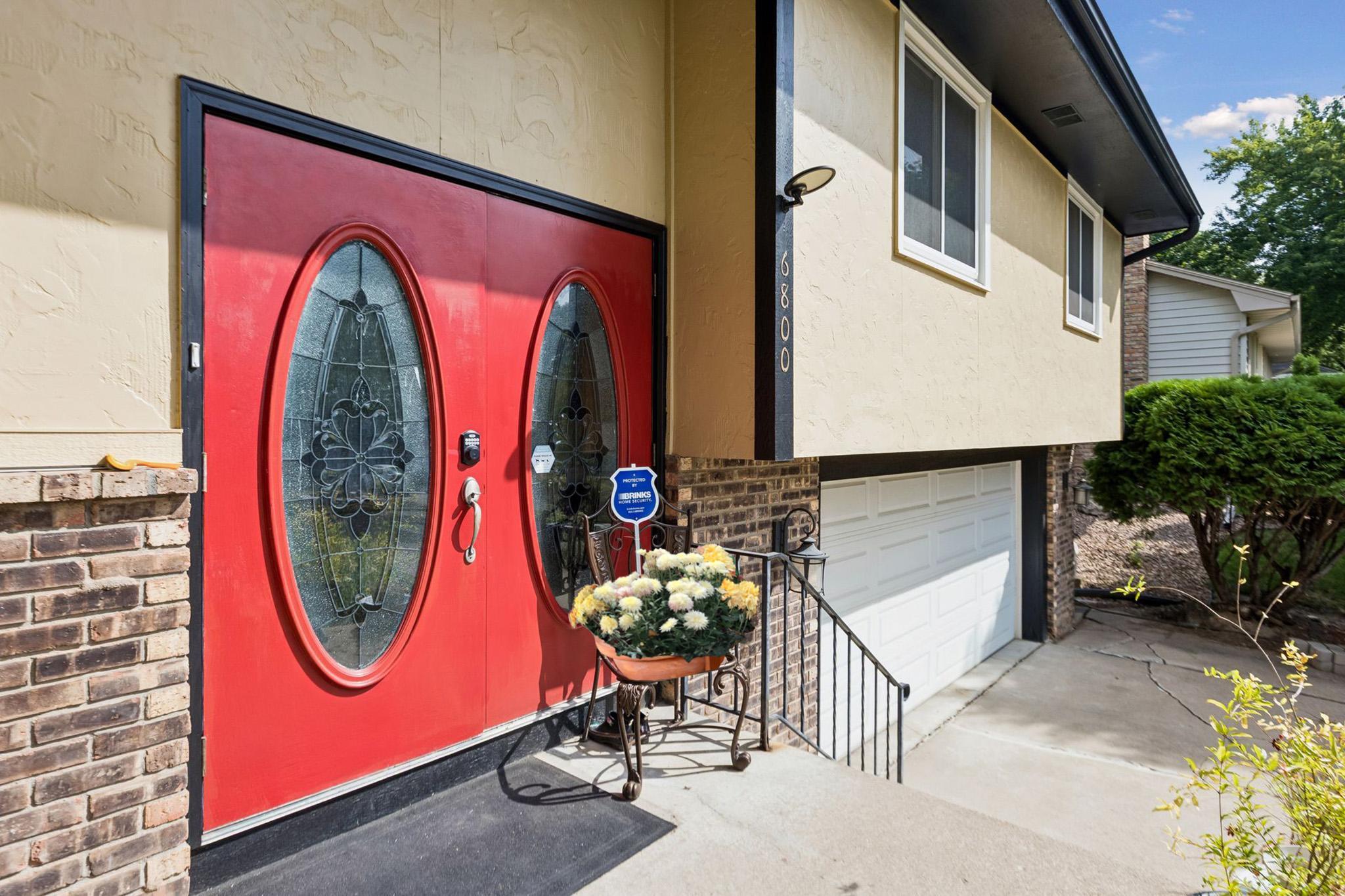9. Welcoming double entry glass door with decorative glass inserts.jpg