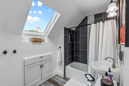 Full bathroom with skylight
