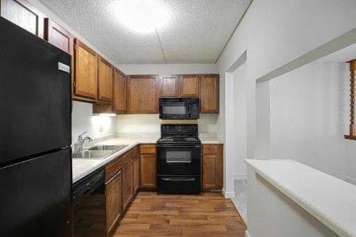 Kitchen with pass through to dining area.