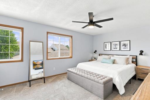 Massive 19 x 12 primary bedroom with dual windows & new window treatments. Large walk-in closet with tons of space.