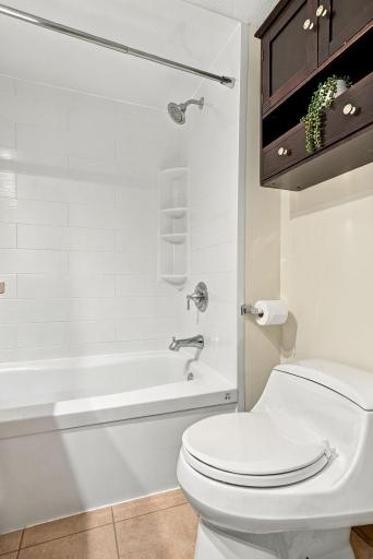 A clean, functional full bath with tub and shower.