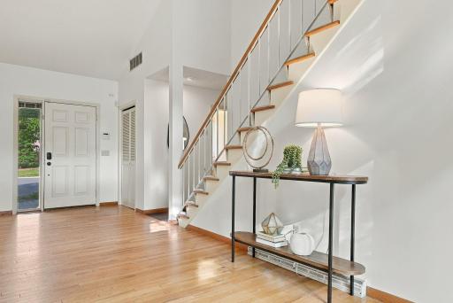 The bright entry introduces the homeâs vaulted ceilings and distinctive architectural lines.
